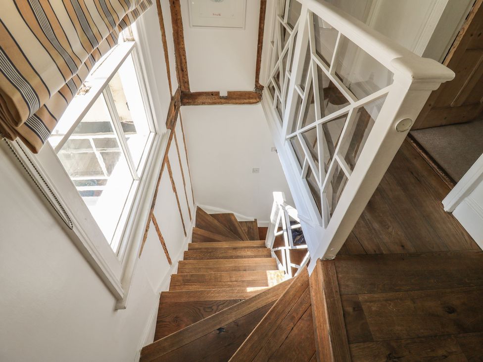 A staircase with wooden steps and a window at Beresford House in Woodbridge