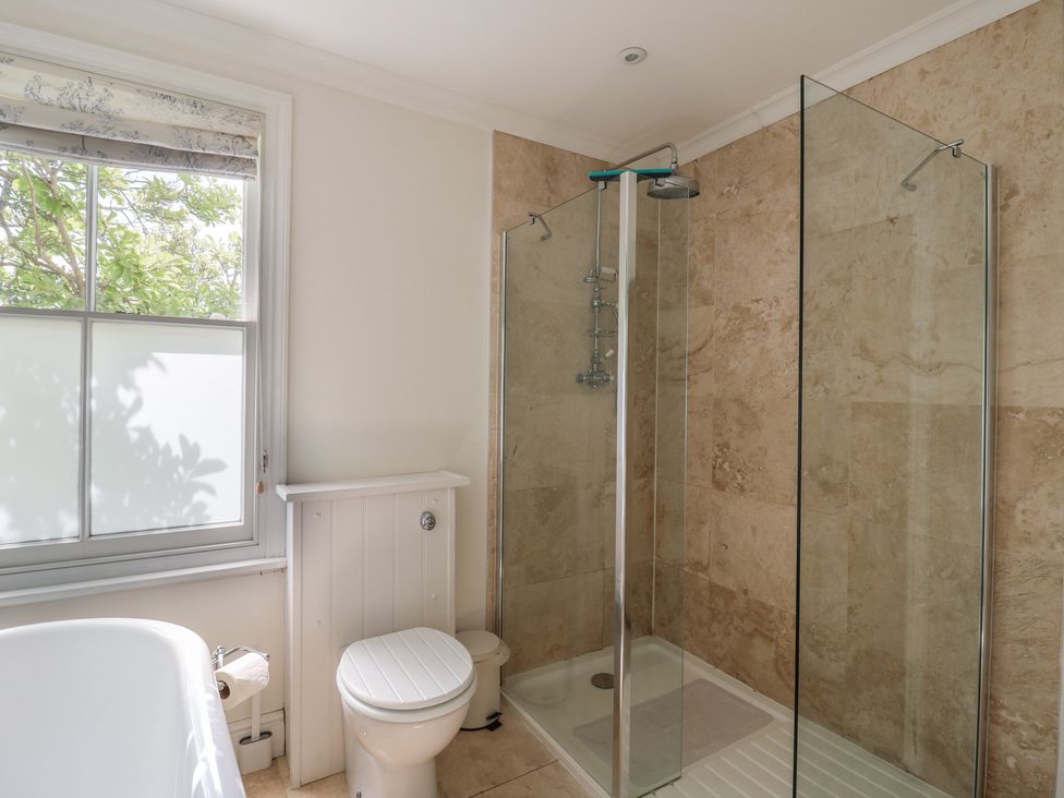 A bathroom with a shower and bathtub at Beresford House in Woodbridge