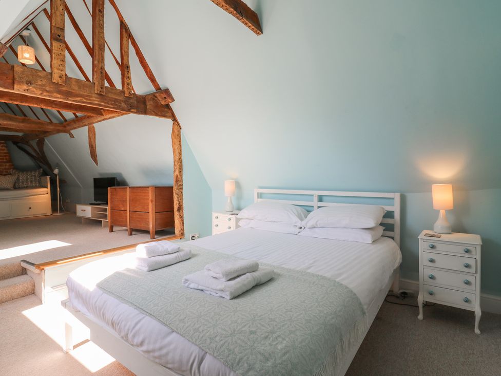 A bedroom with a bed and television at Beresford House in Woodbridge