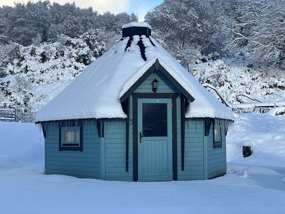 A cabin covered in snow at Little Luxe Lodges 1 in Kyle