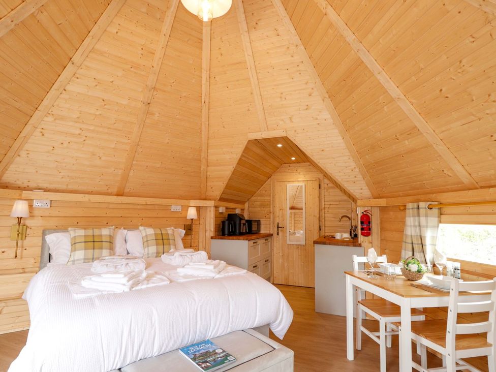 A bedroom with a bed and kitchenette at Little Luxe Lodges 1 in Kyle