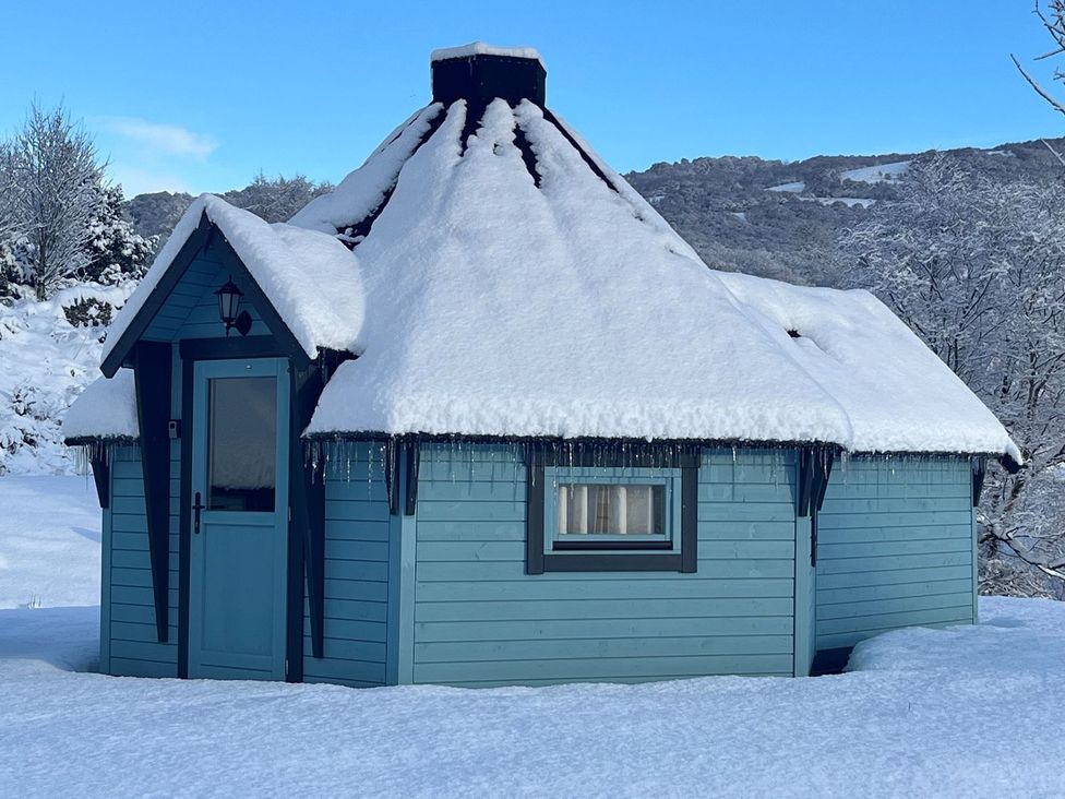A cabin covered in snow at Little Luxe Lodges 2 in Kyle