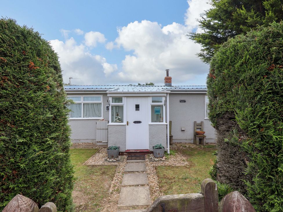 A house entrance with a pathway and garden at Four Seasons in Humberston, Lincolnshire