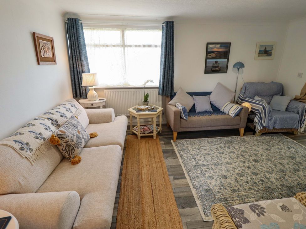 A living room with seating and a coffee table at Four Seasons, Humberston, Lincolnshire