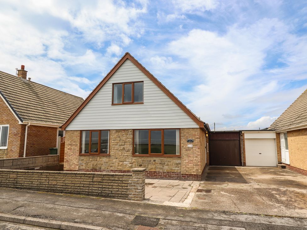 A house with stone facade and garage at Sandringham in Withernsea