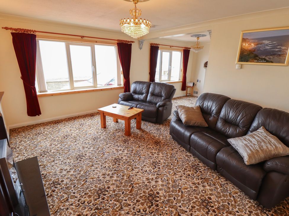 A living room with a coffee table and sofas at Sandringham in Withernsea