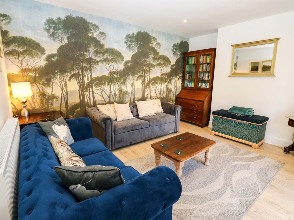 A living room with sofas and a coffee table at Stewards House in Tadcaster