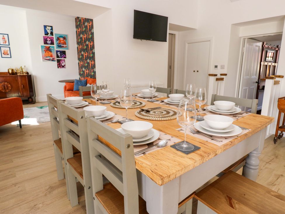 A dining room with a large table set for a meal at Stewards House Tadcaster