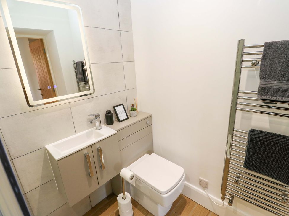 A bathroom with a sink and toilet at Stewards House in Tadcaster
