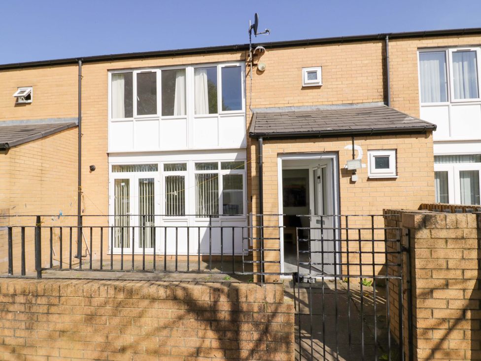 An exterior view of a brick house with windows and a door at 2 Carpenters Court in Birmingham