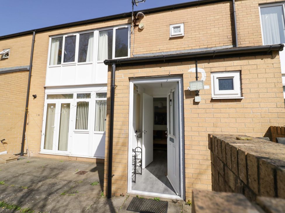 An outdoor area of a property showing a door and windows at 2 Carpenters Court Birmingham