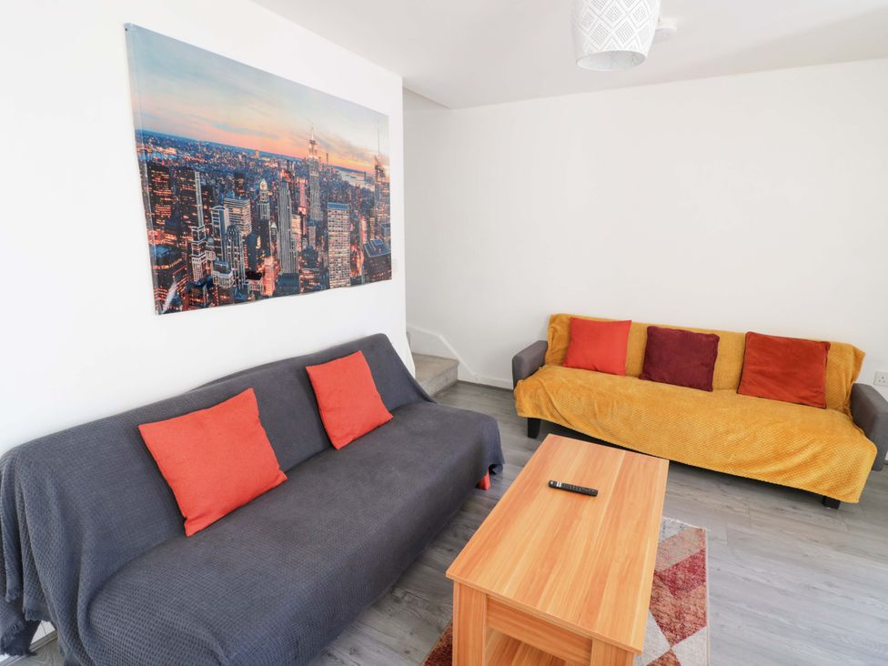 A living room with two sofas and a coffee table at 2 Carpenters Court in Birmingham