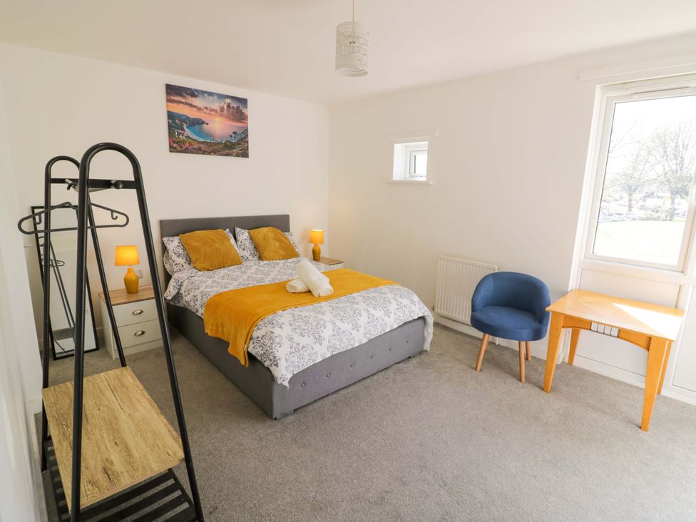 A bedroom with a bed and nightstand at 2 Carpenters Court in Birmingham