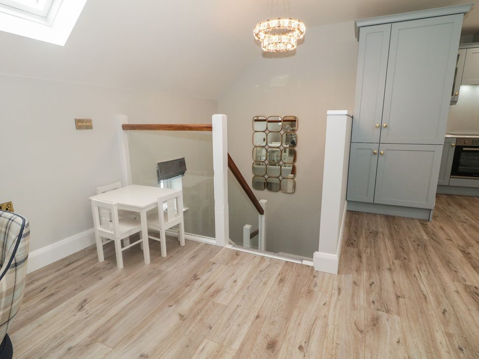 A landing with a table and chairs at 2 Ard an Chuain Dunfanaghy