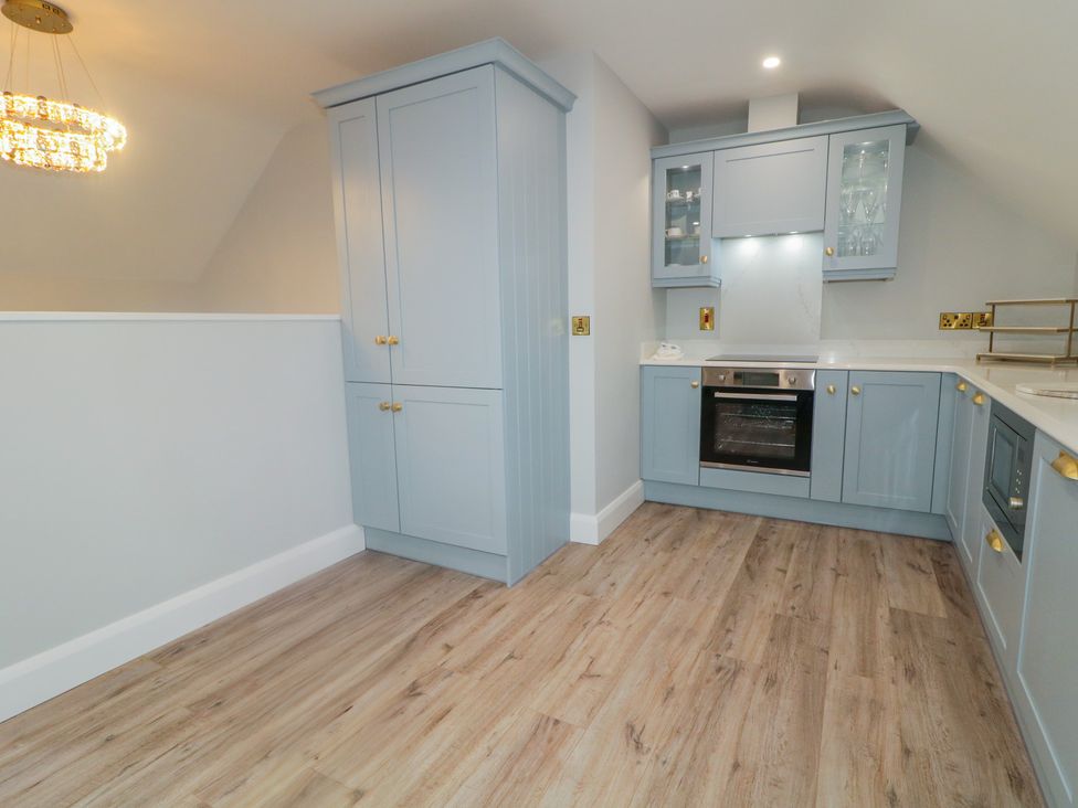 A kitchen with cabinets and an oven at 2 Ard an Chuain Dunfanaghy