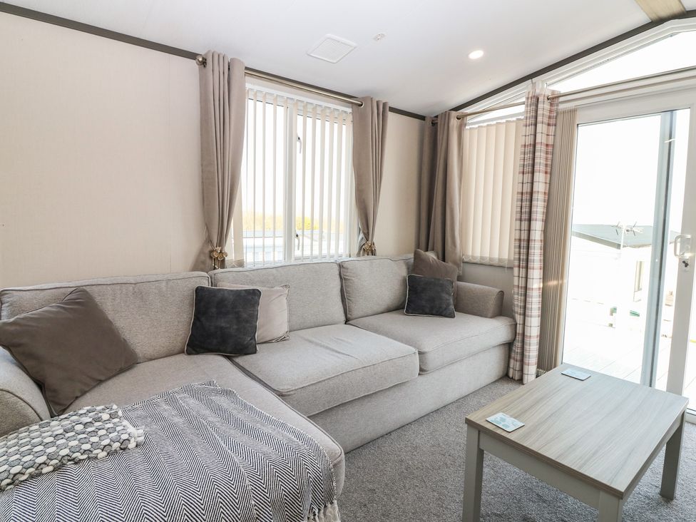 A living room with a sofa and table at Plot 243 - Coldingham Bay Leisure Park Eyemouth