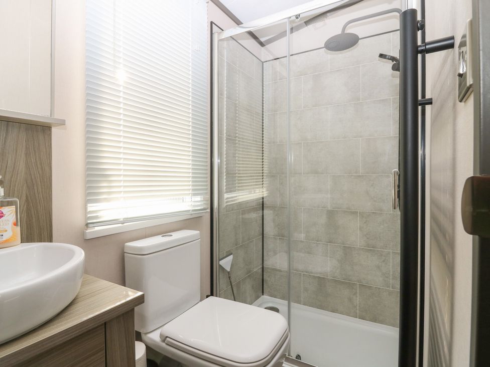 A bathroom with sink, toilet, and shower at Plot 243 - Coldingham Bay Leisure Park, Eyemouth