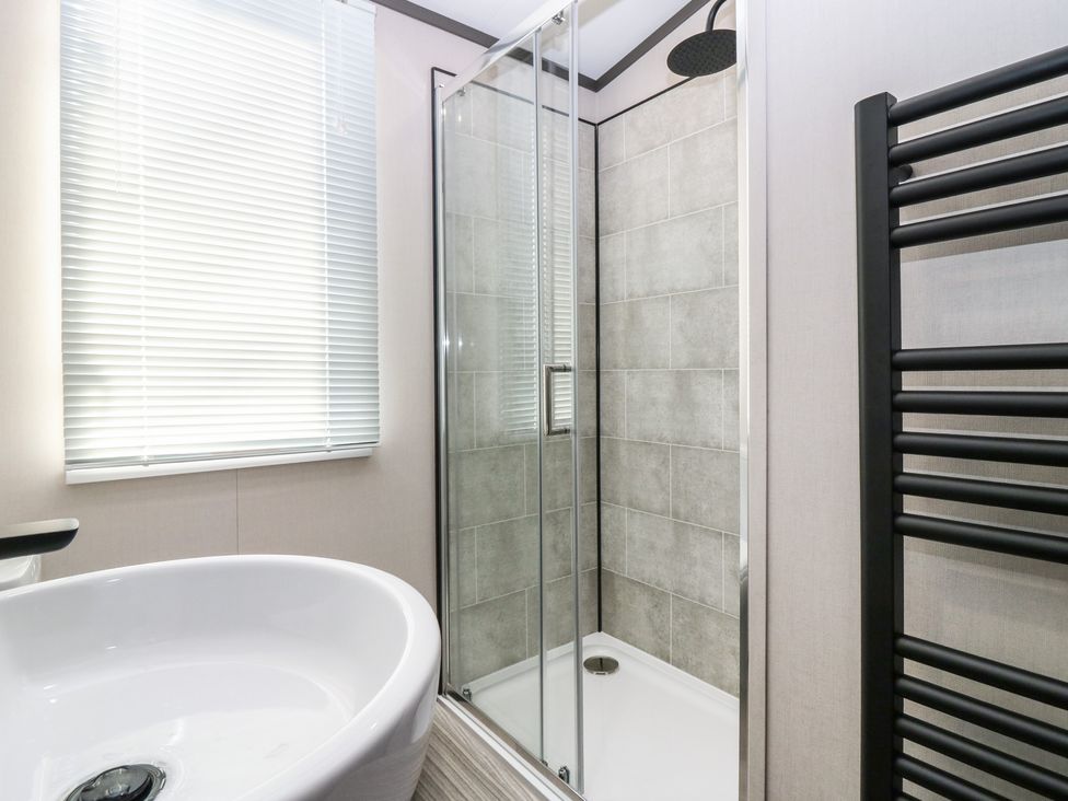 A bathroom with a bathtub and a shower at Plot 243 - Coldingham Bay Leisure Park Eyemouth