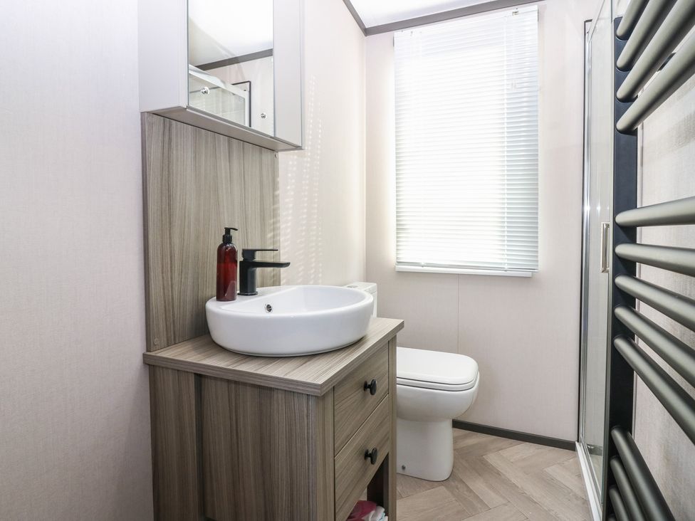 A bathroom with sink, toilet, and shower at Plot 243 - Coldingham Bay Leisure Park Eyemouth