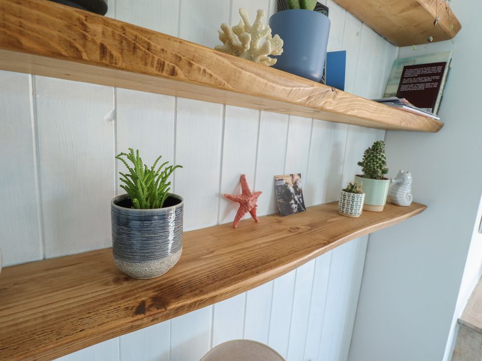 A shelf with plants and decorations at Sorrento in Mablethorpe
