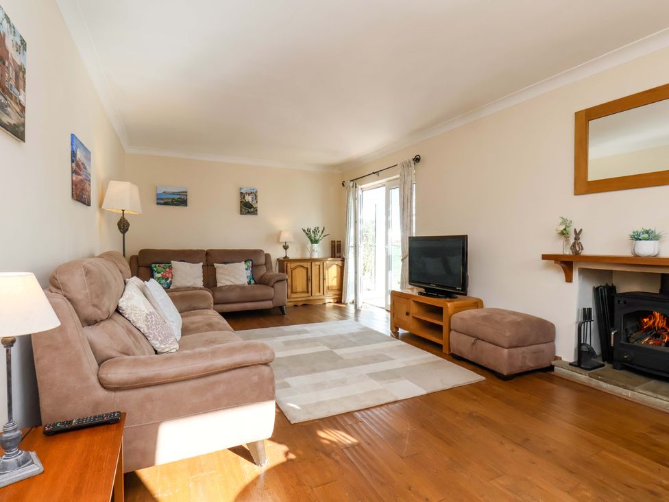 A living room with a sofa and television at The Nook in Robin Hood’s Bay