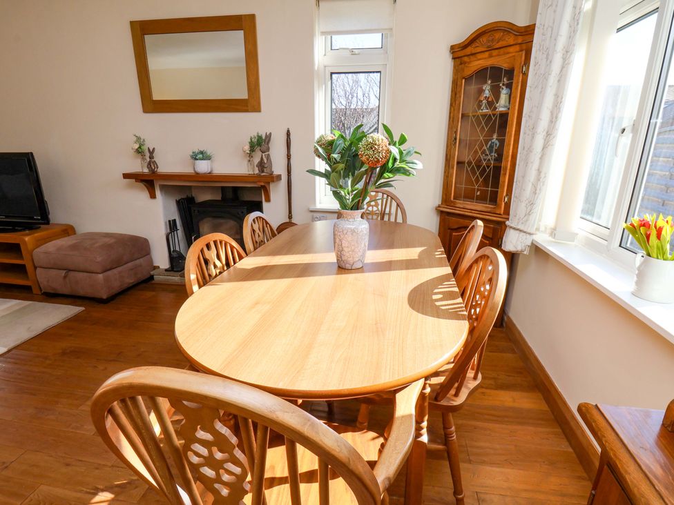 A dining room with a table and chairs at The Nook in Robin Hood’s Bay