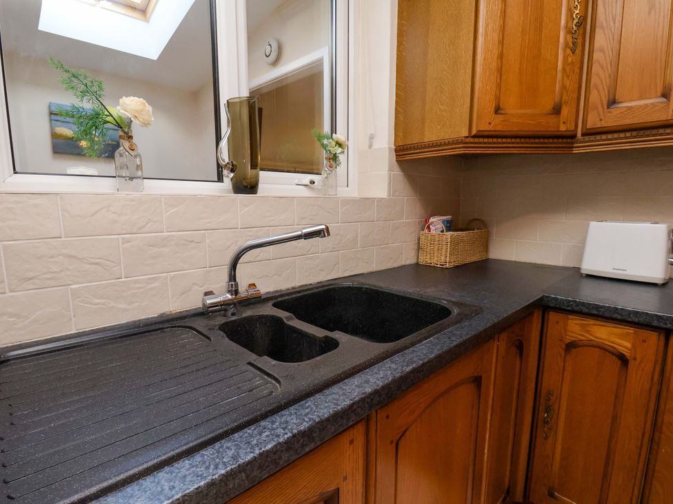 A kitchen with a sink and countertop at The Nook in Robin Hood’s Bay