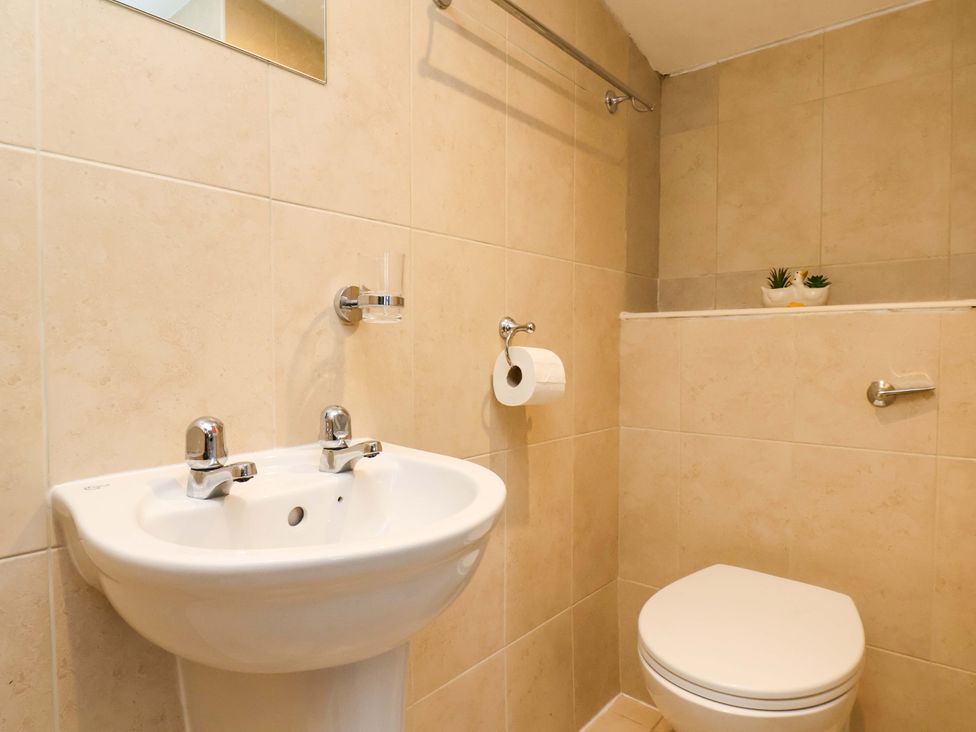 A bathroom with a sink and toilet at The Nook in Robin Hood’s Bay
