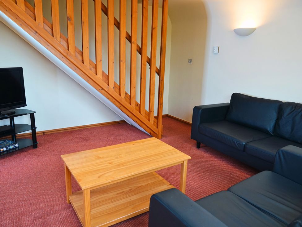 A living room with a sofa and coffee table at Bracken Lodge Finlakes Holiday Park near Chudleigh