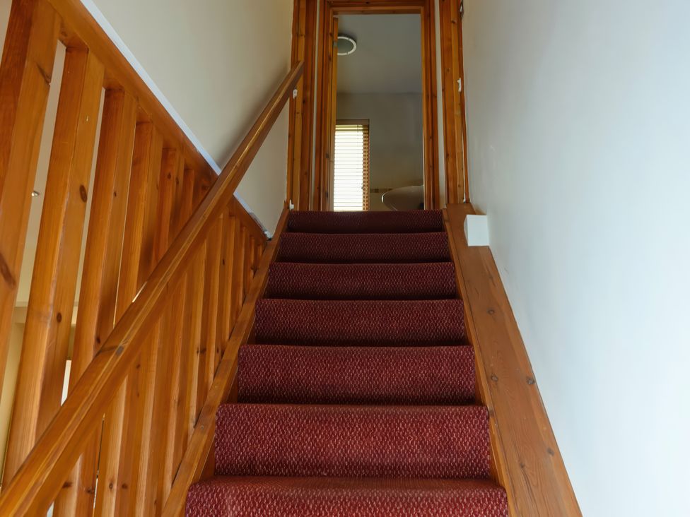A staircase leading to an upper level at Bracken Lodge Finlakes Holiday Park near Chudleigh