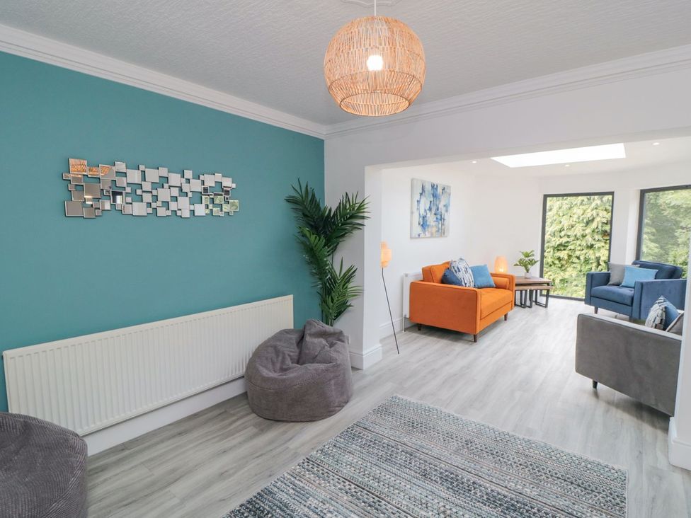 A living room with sofas and a coffee table at Riverside House in Scarborough