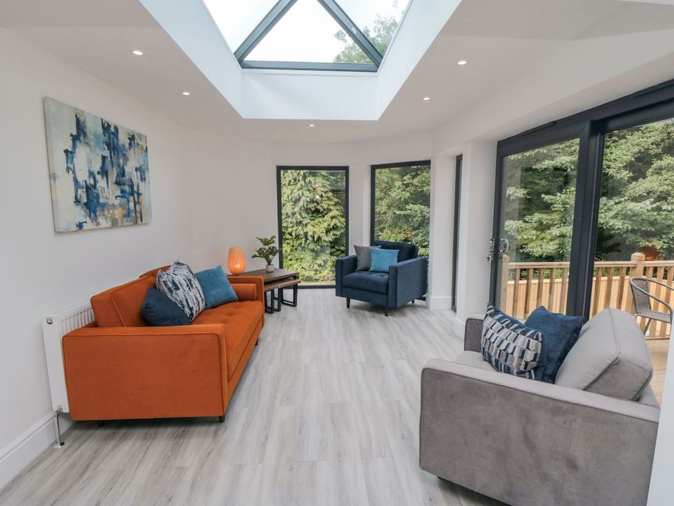 A snug with seating and windows at Riverside House in Scarborough