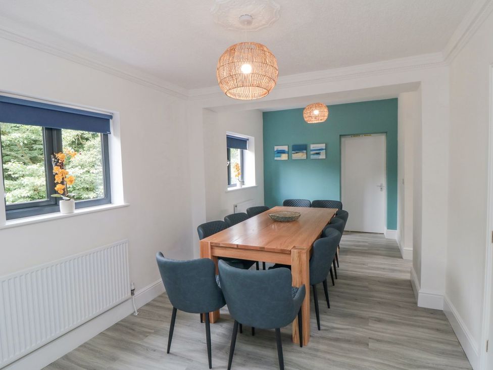 A dining room with a table and chairs at Riverside House in Scarborough