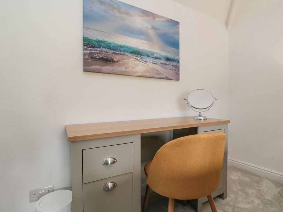 An office with a desk and mirror at Riverside House in Scarborough