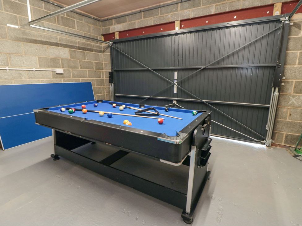 A game room with a pool table and billiard balls at Riverside House in Scarborough