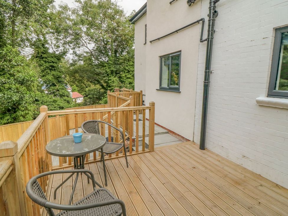 A balcony with table and chairs at Riverside House in Scarborough