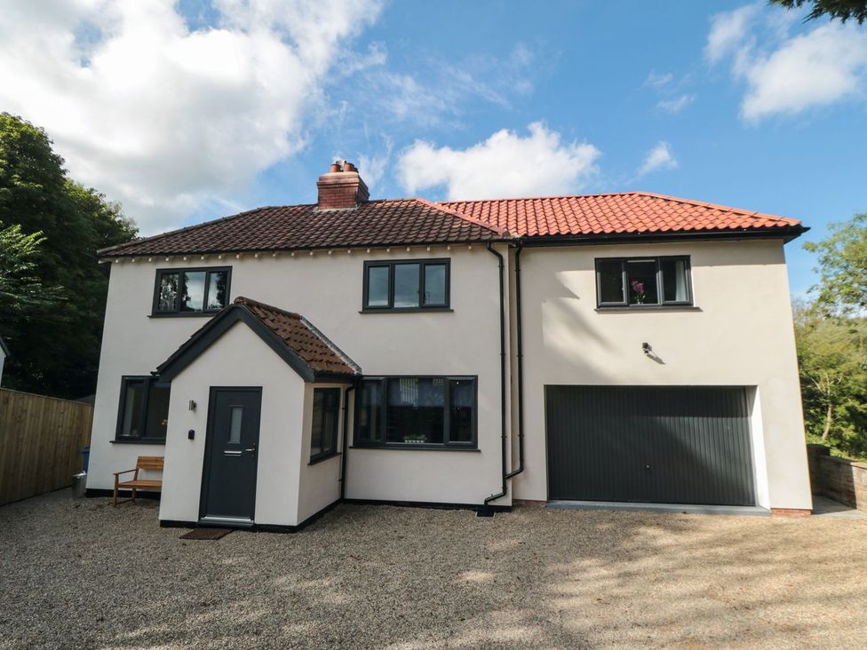 A house with a garage and pathway at Riverside House in Scarborough