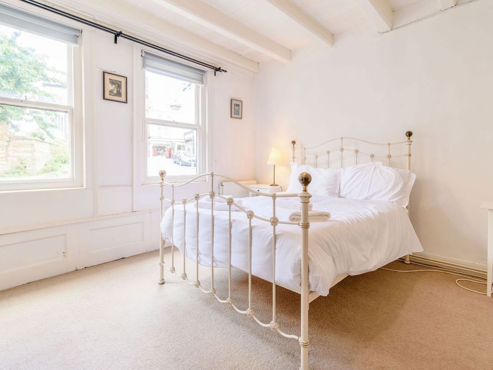 A bedroom with a bed and lamp at The Anchorage in Whitby