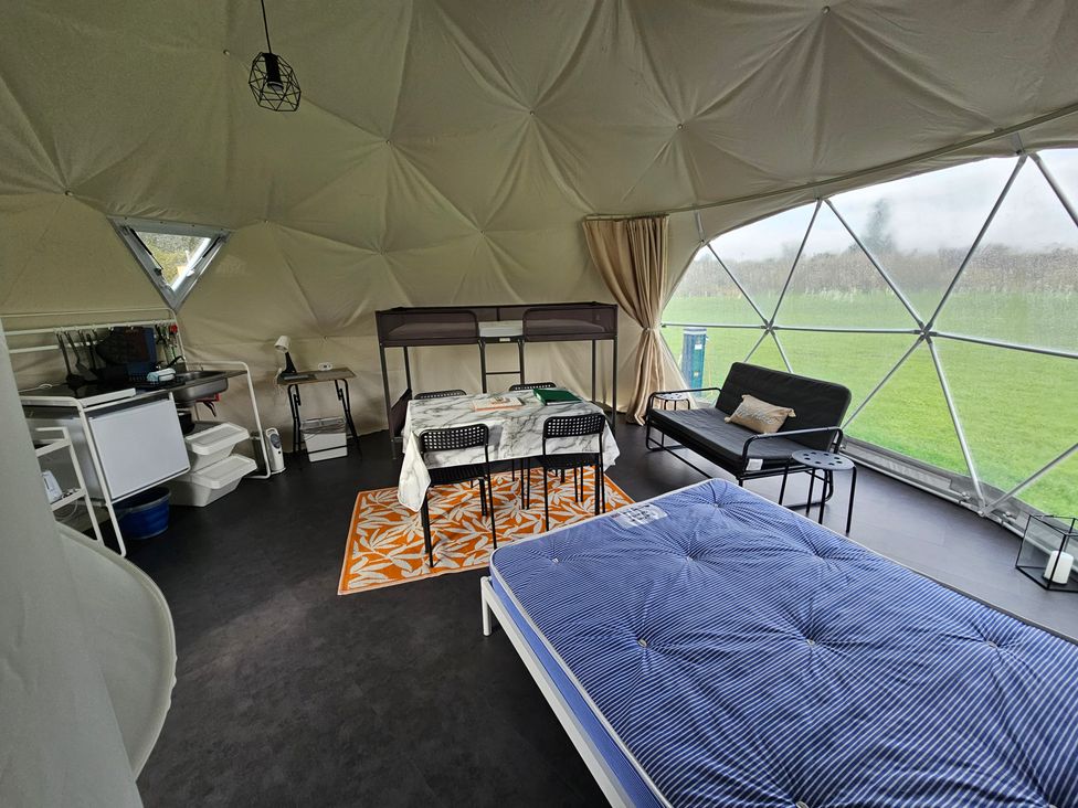 A room with a bed, kitchenette, and seating area at Sherwood - Geodome in Mansfield