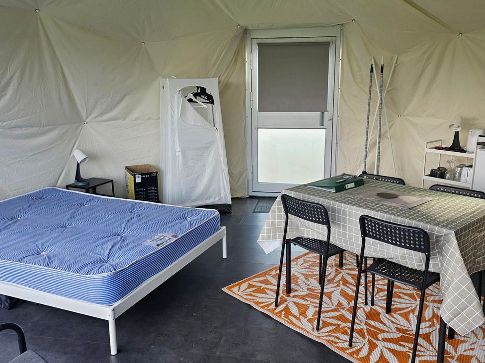 A room with a bed and table at Sherwood - Geodome in Mansfield