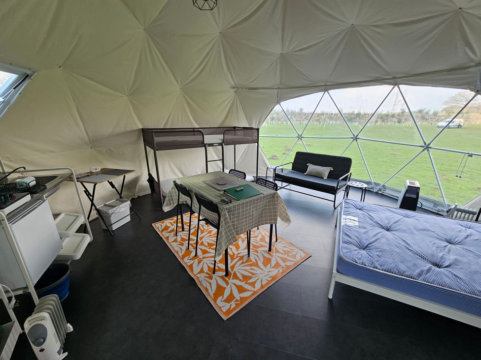 A living room with a dining table and chairs at Sherwood - Geodome in Mansfield