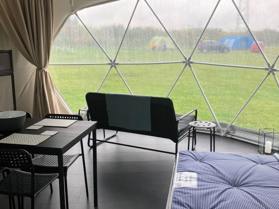 A living room with a sofa and a table at Sherwood - Geodome Mansfield