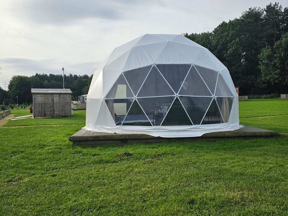 A geodesic dome on grass at Sherwood - Geodome in Mansfield