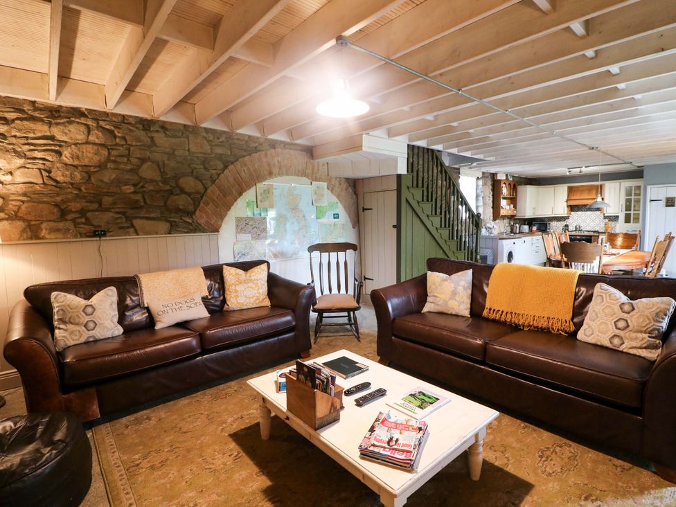 A living room with a sofa and coffee table at Childwall Cottage in TULLOGHER