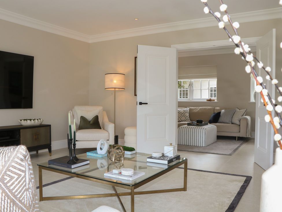 A living room with a coffee table and sofa at Sea Estate House in Littlehampton