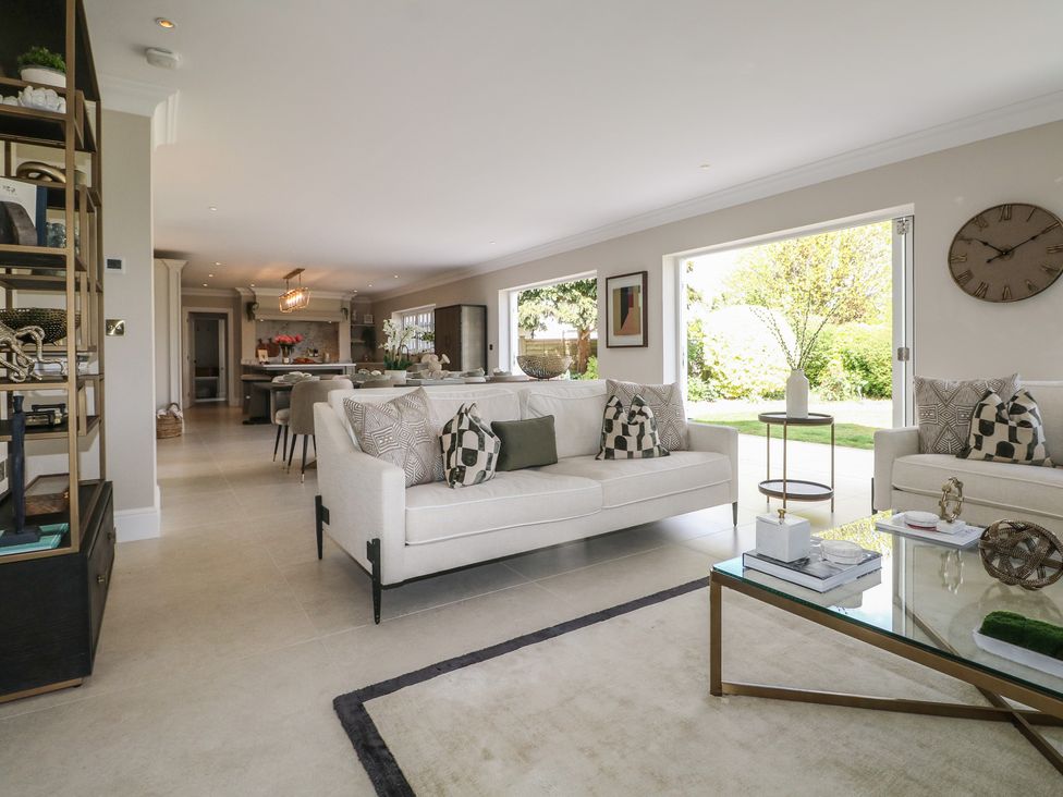 A living room with a sofa and coffee table at Sea Estate House in Littlehampton