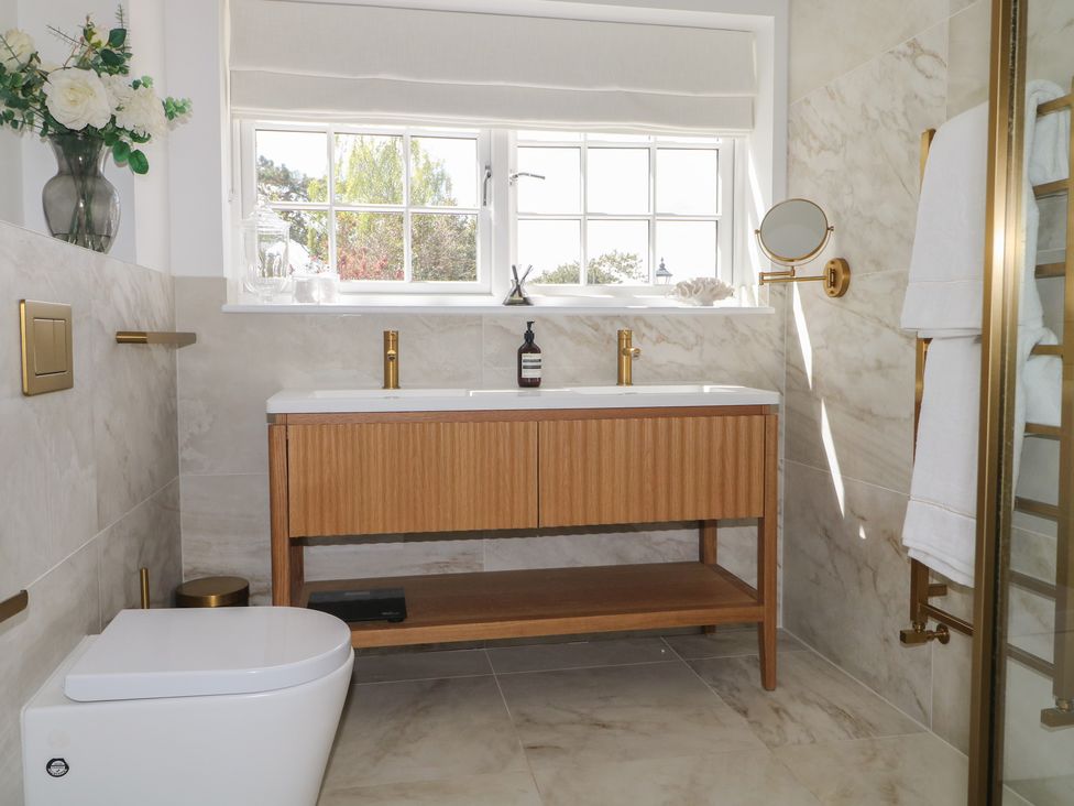 A bathroom with a sink and toilet at Sea Estate House in Littlehampton