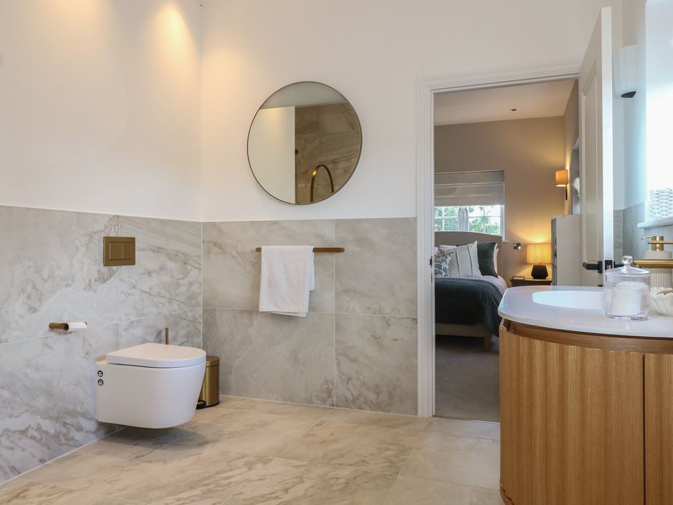 A bathroom with a toilet and sink at Sea Estate House in Littlehampton
