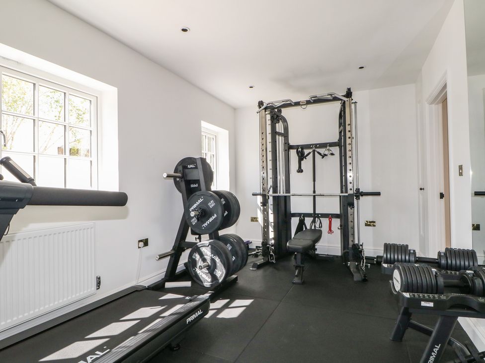 A gym with exercise equipment at Sea Estate House in Littlehampton