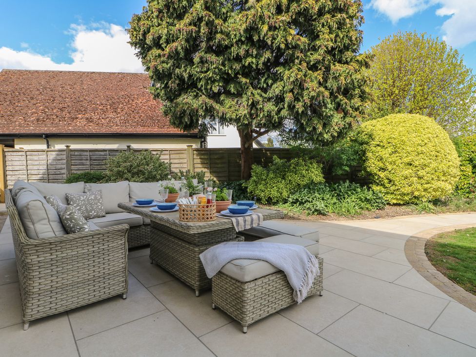 An outdoor patio with a seating area at Sea Estate House in Littlehampton